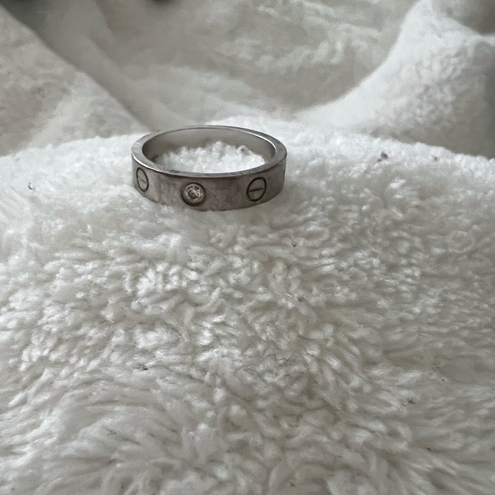Cartier white gold with one diamond ring